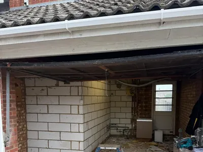 The garage stripped back to blockwork ready for conversion